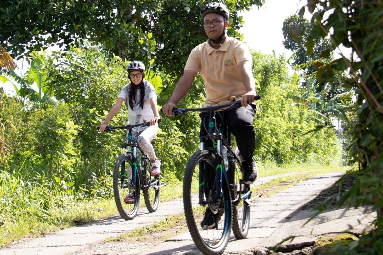 Cycling along a village road near the resort