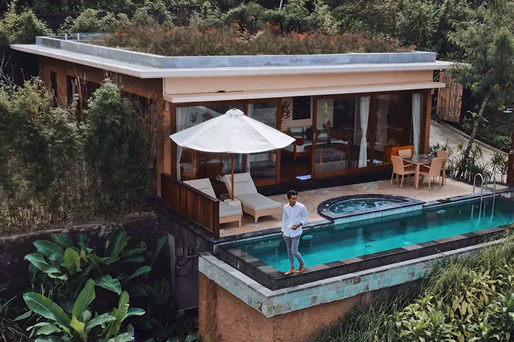 A two-bedroom pool villa with a pool terrace and garden