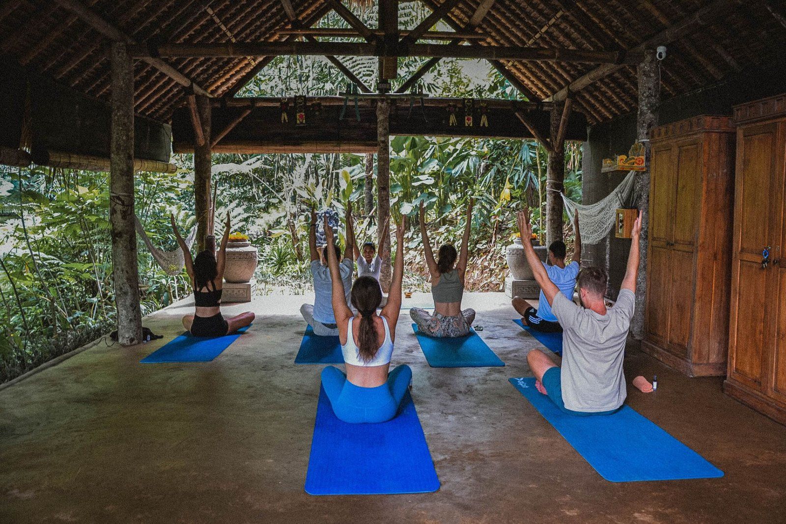 The open-air Yoga Hut surrounded by greenery